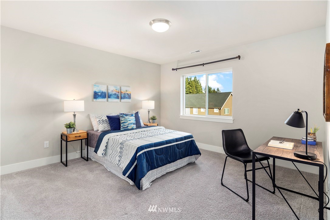 7 176th Place Southeast Bothell, WA 98012 - Photo 22 of 40 a spacious bedroom with a bed and a window