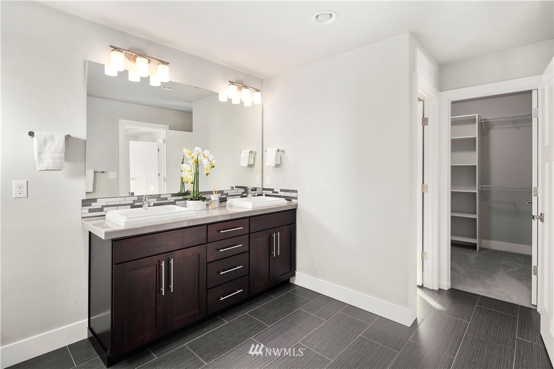 7 176th Place Southeast Bothell, WA 98012 - Photo 24 of 40 a bathroom with a double vanity sink and a mirror