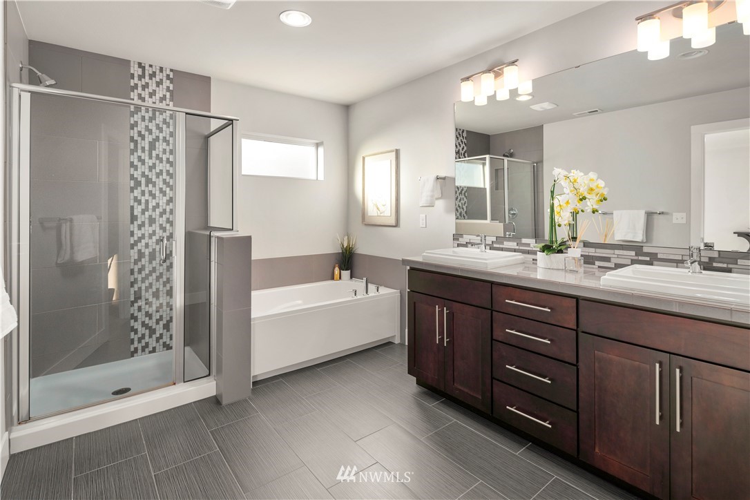 7 176th Place Southeast Bothell, WA 98012 - Photo 27 of 40 a bathroom with a tub sink shower and mirror