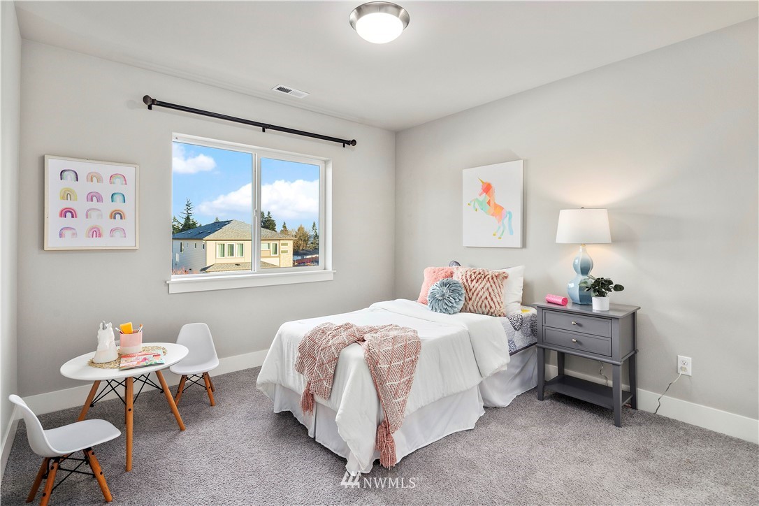 7 176th Place Southeast Bothell, WA 98012 - Photo 29 of 40 a bedroom with a bed and a window