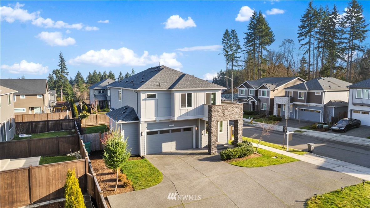 7 176th Place Southeast Bothell, WA 98012 - Photo 3 of 40 a front view of a house with garden