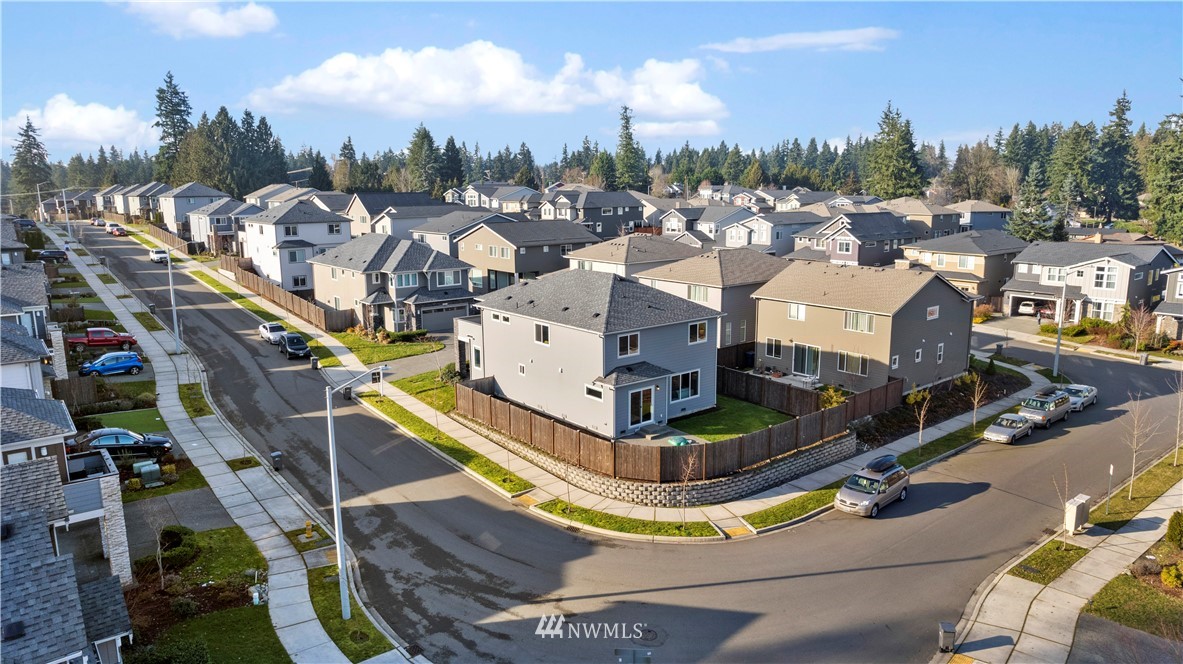 7 176th Place Southeast Bothell, WA 98012 - Photo 38 of 40 a aerial view of a house with swimming pool and large trees