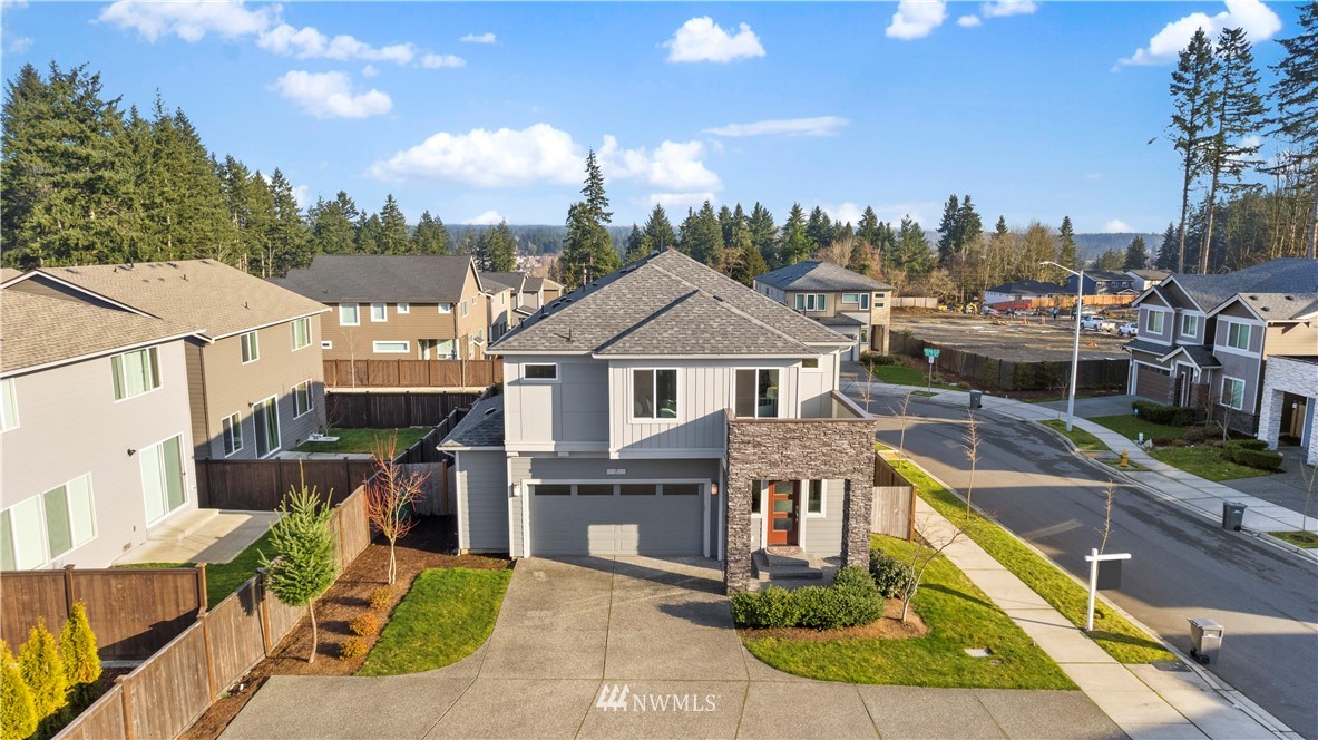 7 176th Place Southeast Bothell, WA 98012 - Photo 4 of 40 a front view of a house with a yard