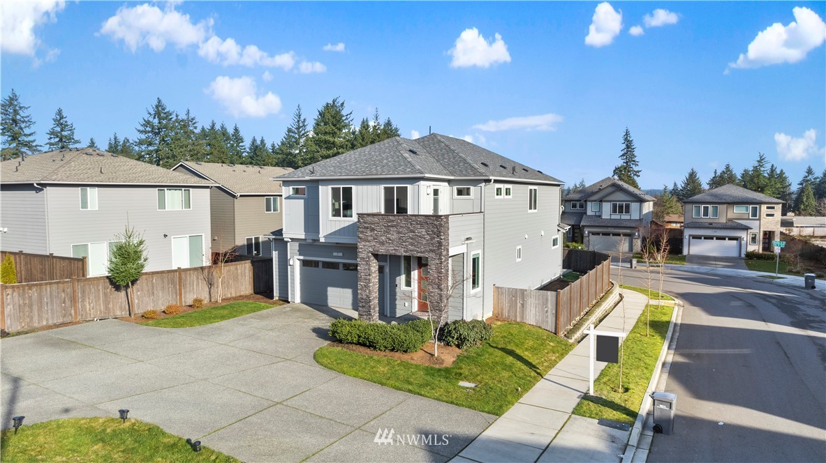7 176th Place Southeast Bothell, WA 98012 - Photo 5 of 40 a view of a house with a patio