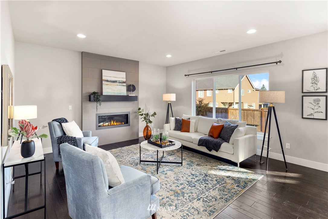 7 176th Place Southeast Bothell, WA 98012 - Photo 7 of 40 a living room with furniture and a fireplace
