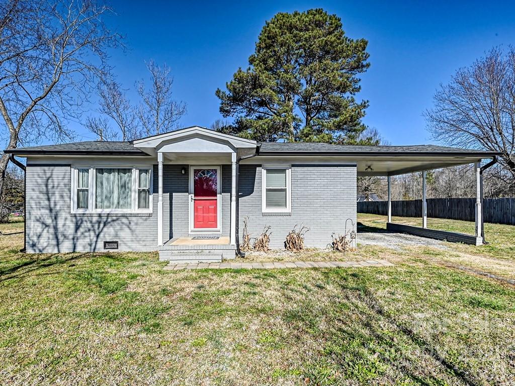 front view of a house with a yard
