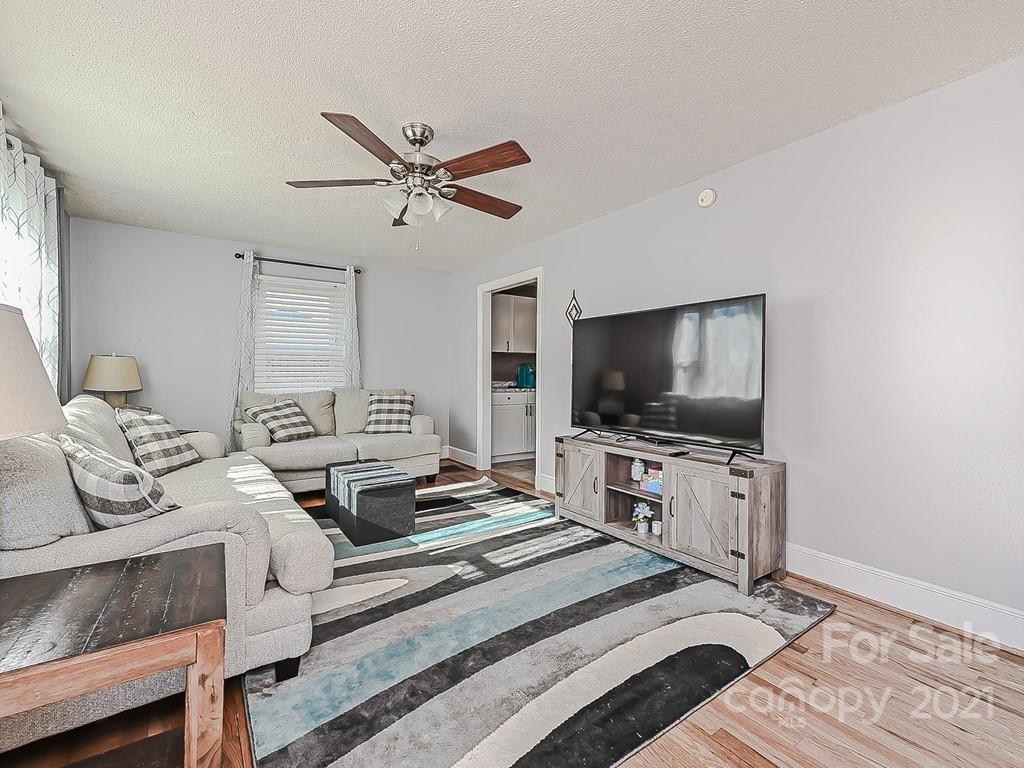 408 West Sandy Ridge Road Monroe, NC 28112 - Photo 3 of 21 a living room with furniture and a flat screen tv