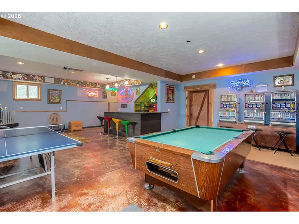 a room with furniture and pool table
