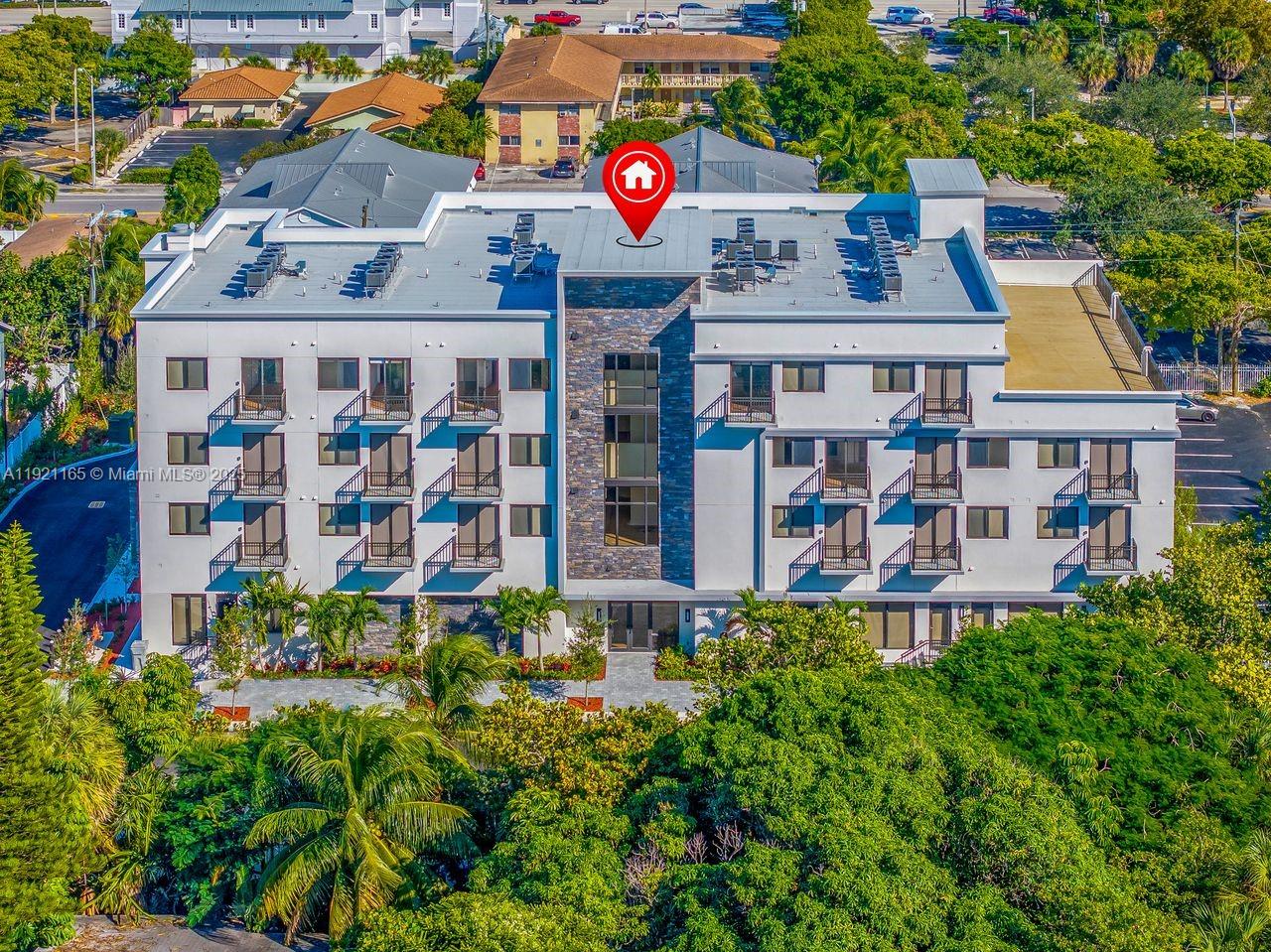 20 Northeast 19th Avenue, Unit 201 Pompano Beach, FL 33060 - Photo 20 of 25 a front view of multi story residential apartment building