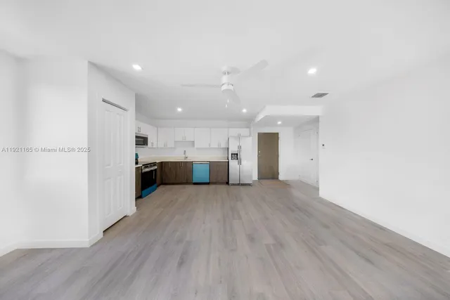 a view of kitchen with wooden floor
