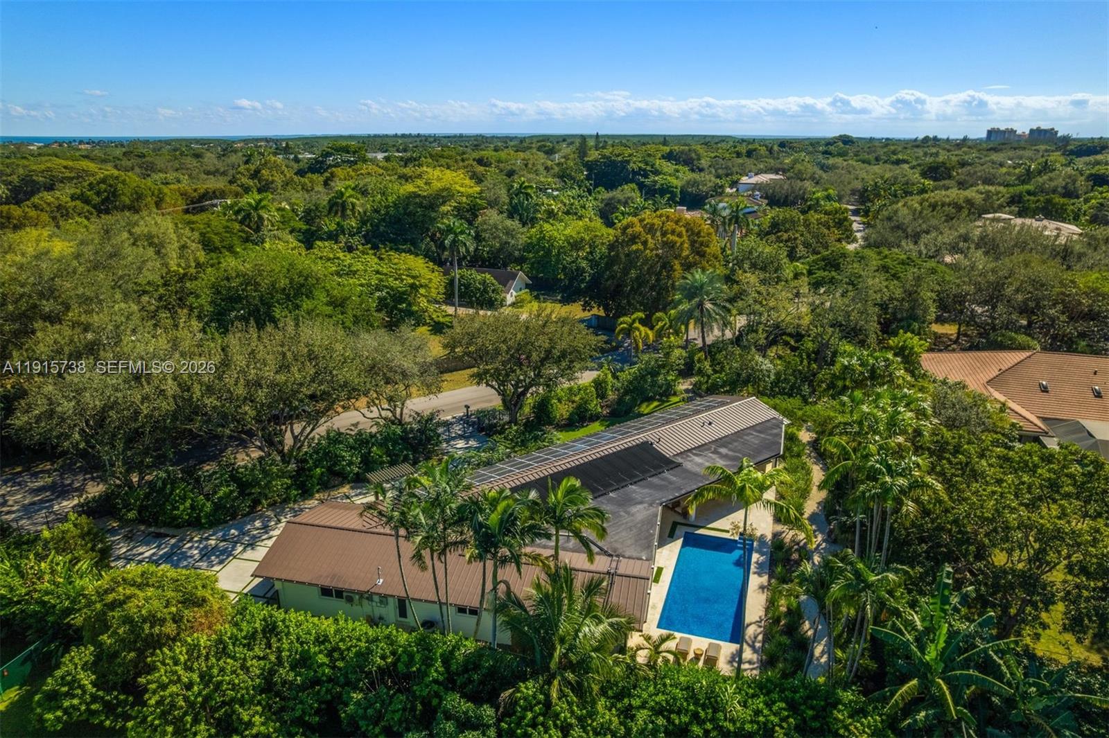 12050 Moss Ranch Road Pinecrest, FL 33156 - Photo 30 of 33 an aerial view of house with yard