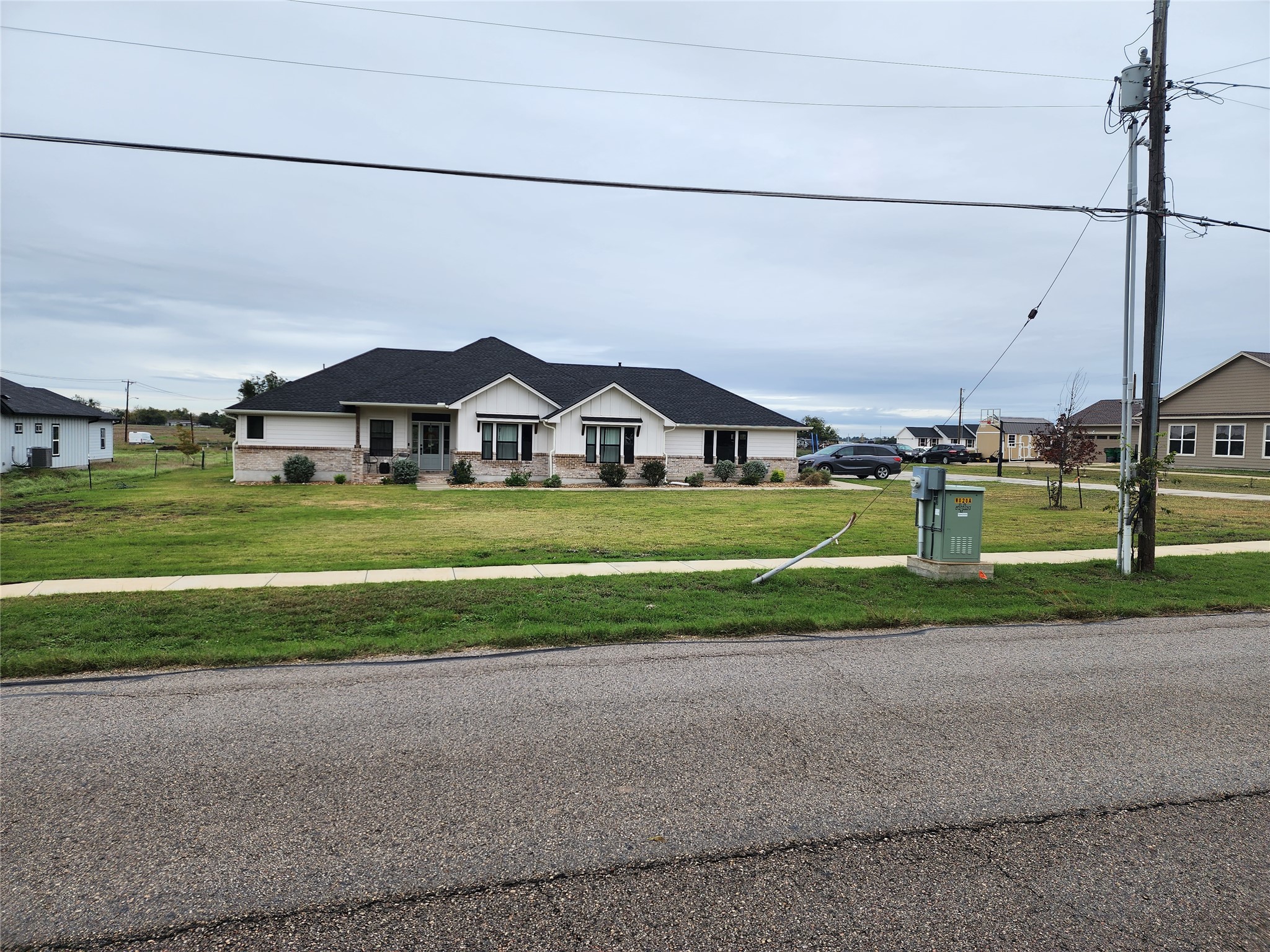 1411 Old Thorndale Road Taylor, TX 76574 - Photo 4 of 9 a view of a house with a big yard and potted plants