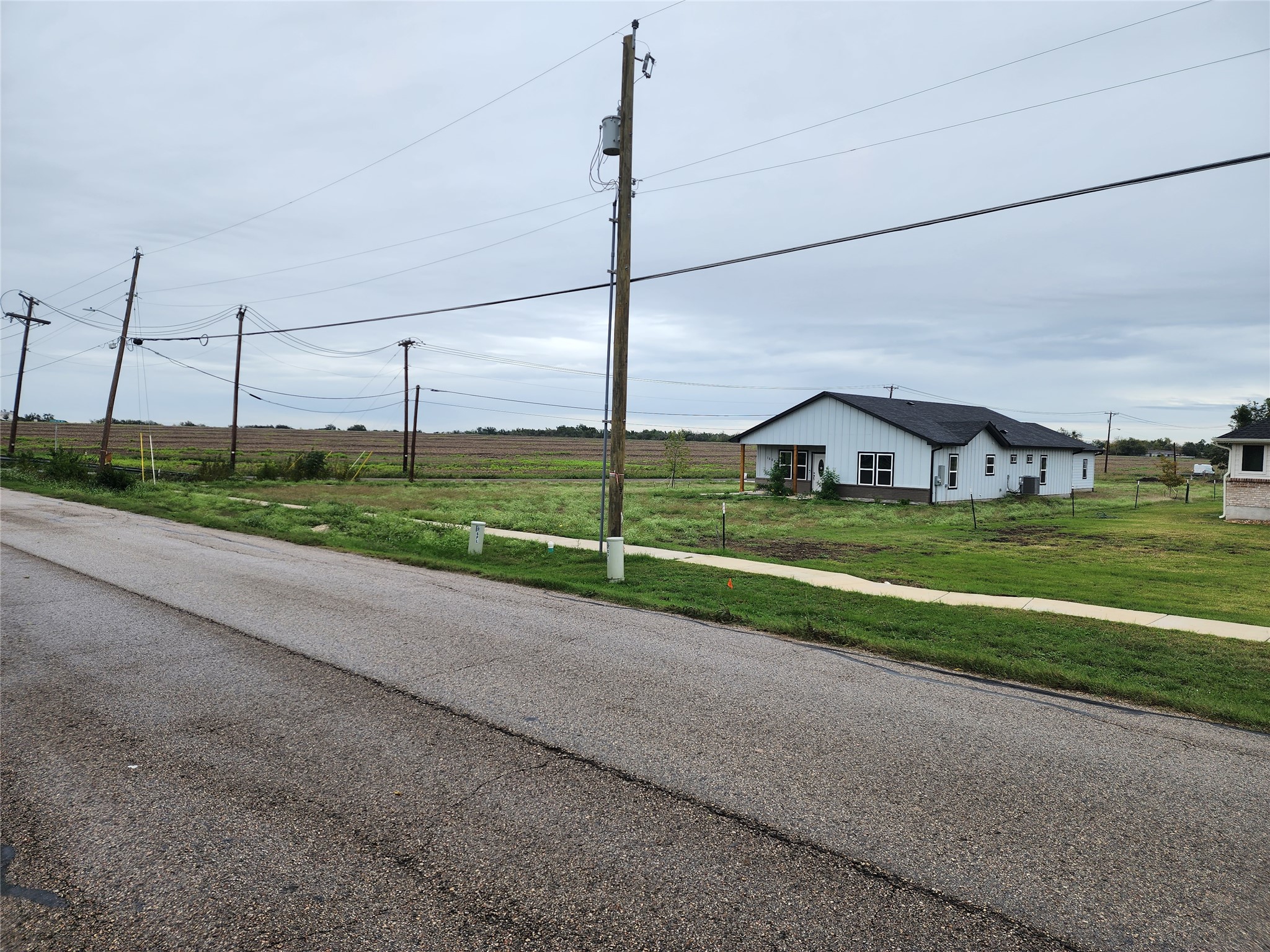 1411 Old Thorndale Road Taylor, TX 76574 - Photo 5 of 9 a view of a road with a big yard