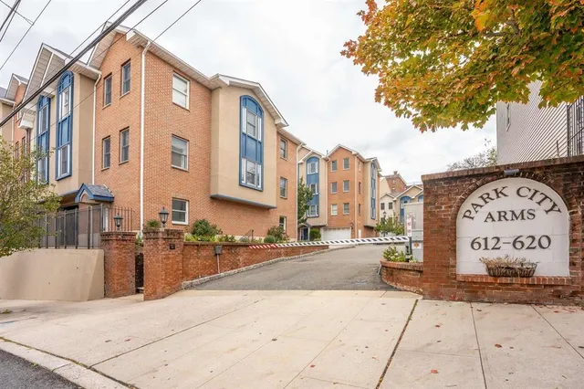 a sign board on the side of a street