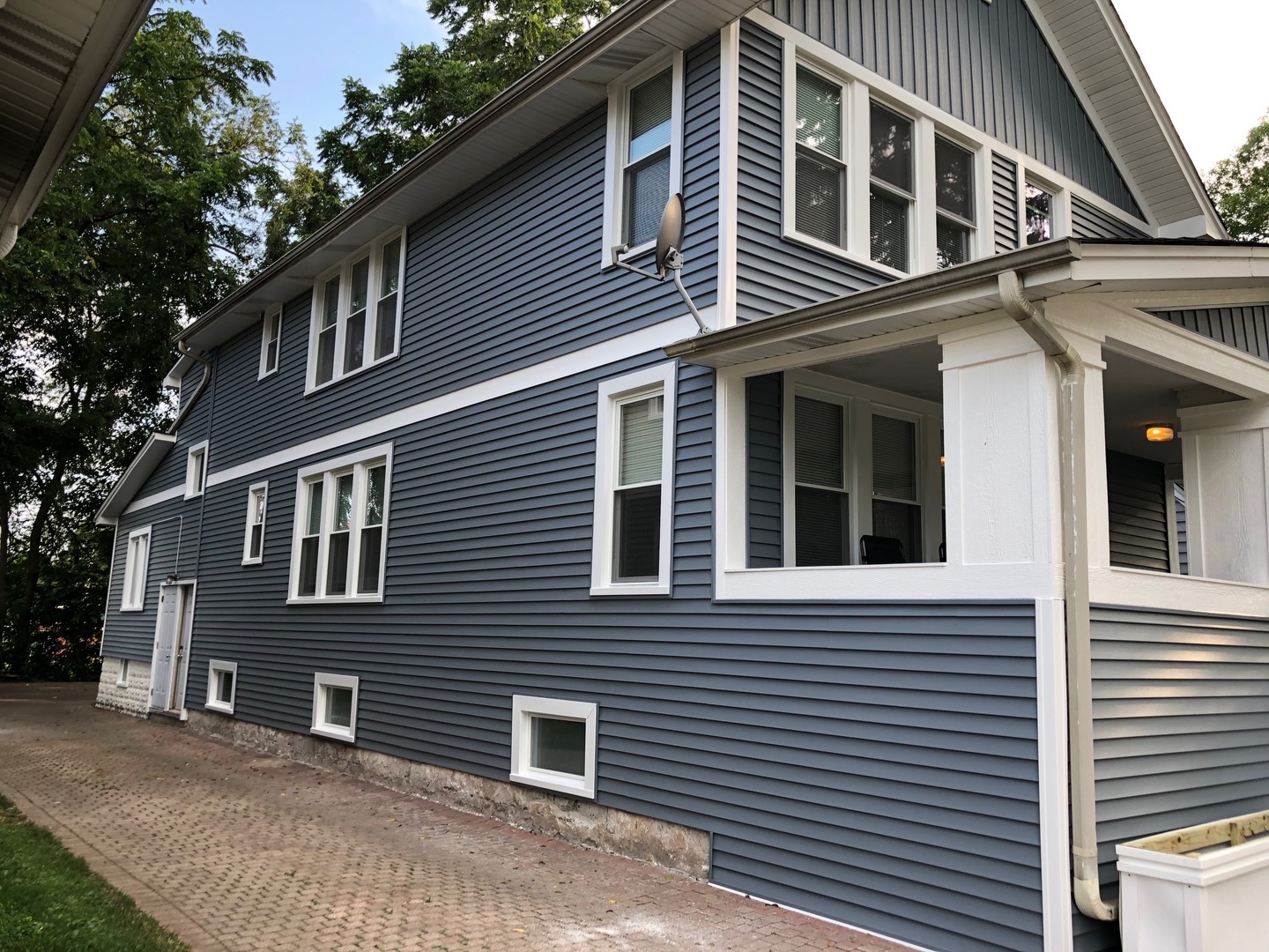 305 West Palatine Road, Unit 2 Palatine, IL 60067 - Photo 2 of 8 a front view of a house with a yard