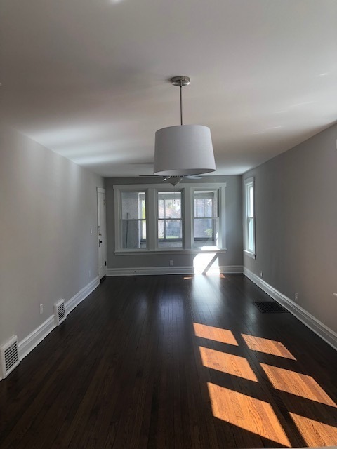 305 West Palatine Road, Unit 2 Palatine, IL 60067 - Photo 4 of 8 a view of wooden floor and windows in a room
