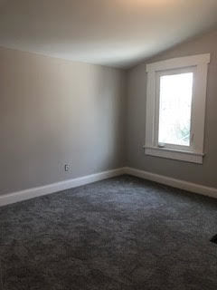 305 West Palatine Road, Unit 2 Palatine, IL 60067 - Photo 6 of 8 an empty room with a window