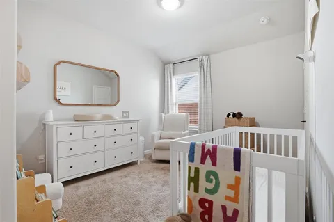 a bedroom with furniture and a window