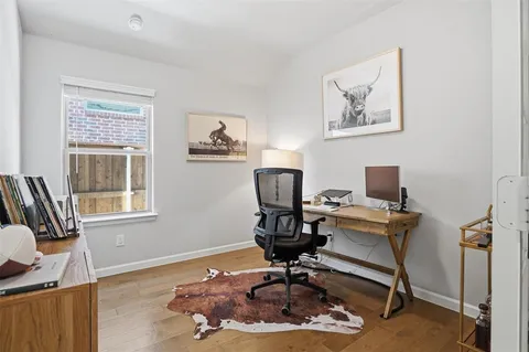 a workspace with furniture and a window