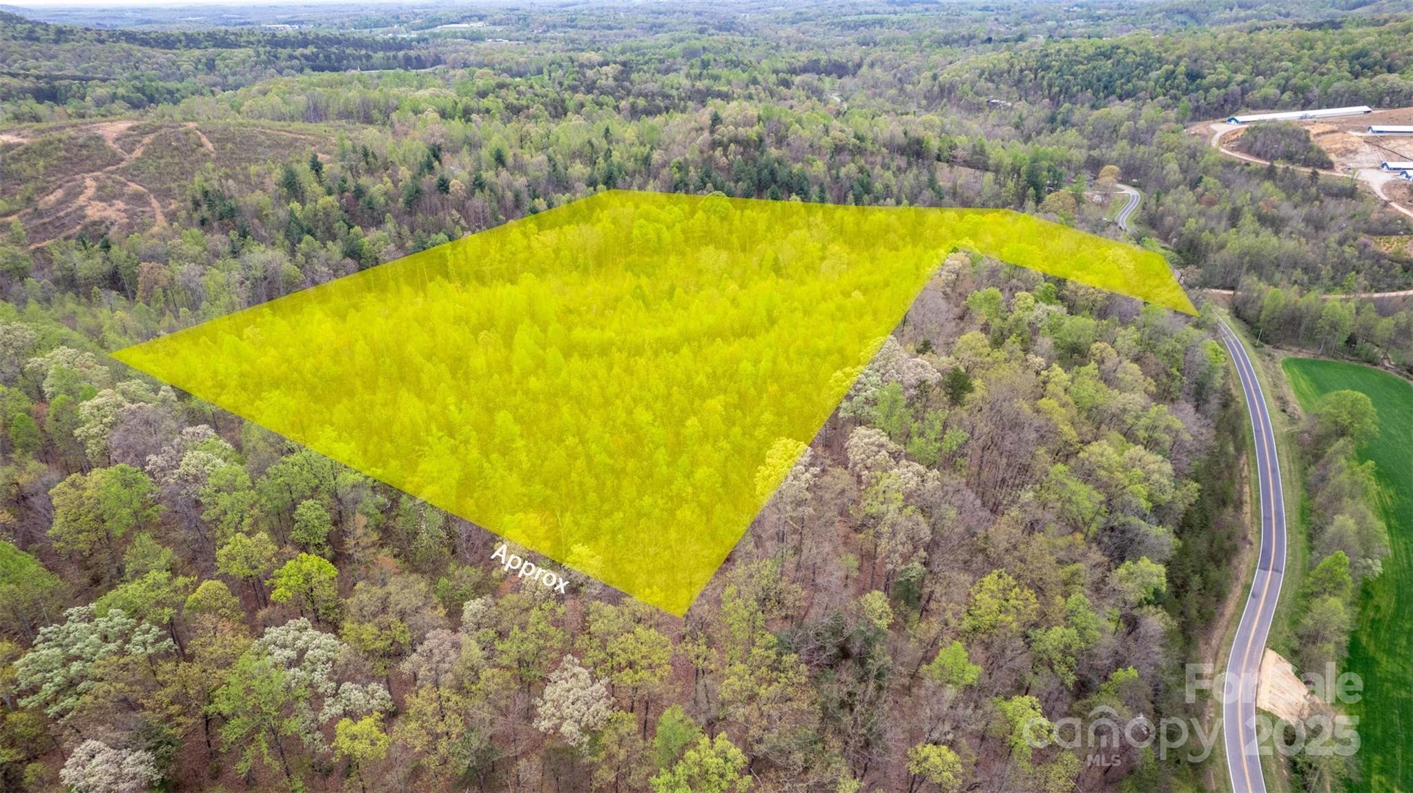 0 Old Vashti Road, Unit 2 Taylorsville, NC 28681 - Photo 17 of 37 a view of a swimming pool with a yard and large trees