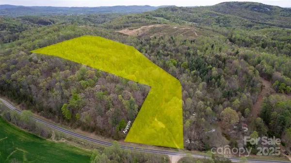 a view of swimming pool with a yard