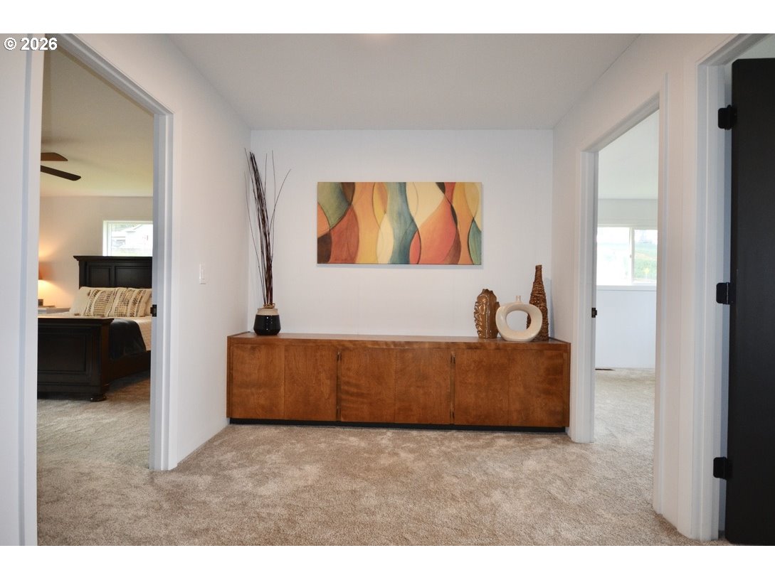10854 Summit Loop Road Southeast Turner, OR 97392 - Photo 13 of 35 a living room with furniture and a flat screen tv