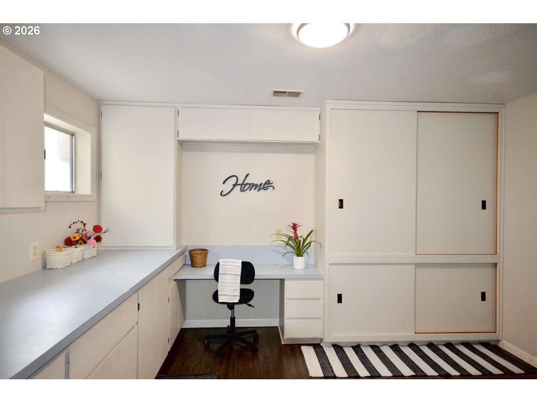 10854 Summit Loop Road Southeast Turner, OR 97392 - Photo 21 of 35 a view of cabinets with wooden floor