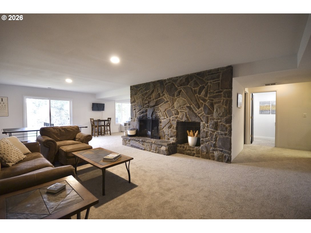 10854 Summit Loop Road Southeast Turner, OR 97392 - Photo 22 of 35 a living room with furniture and a fireplace
