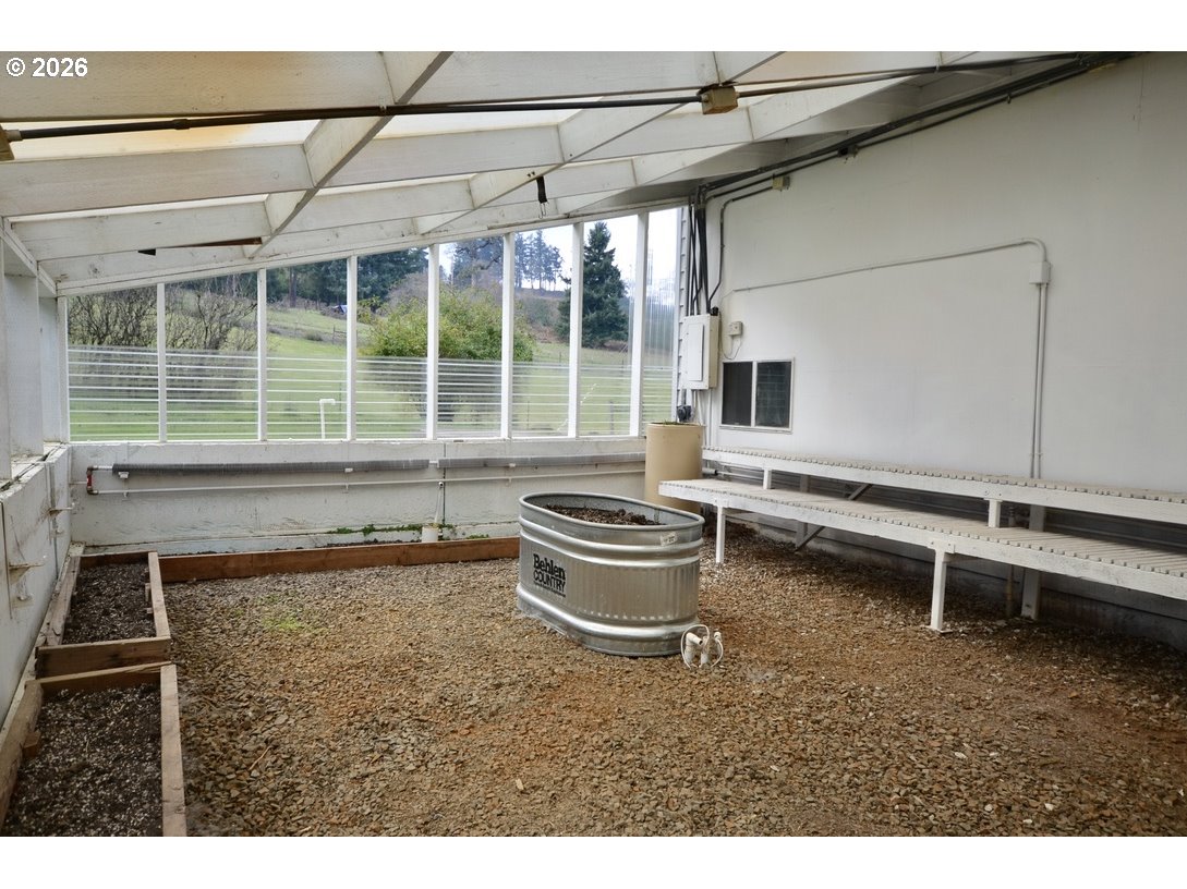 10854 Summit Loop Road Southeast Turner, OR 97392 - Photo 28 of 35 a living room with furniture and a potted plant