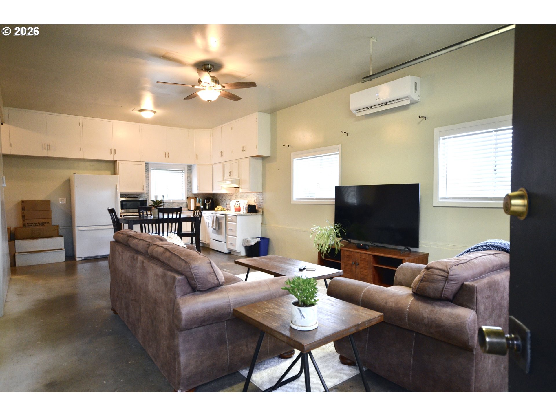 10854 Summit Loop Road Southeast Turner, OR 97392 - Photo 29 of 35 a living room with furniture and a flat screen tv