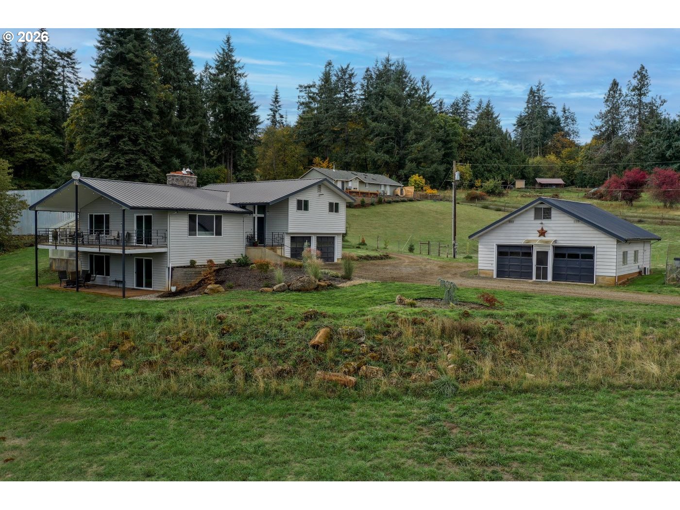 10854 Summit Loop Road Southeast Turner, OR 97392 - Photo 3 of 35 a front view of a house with a yard