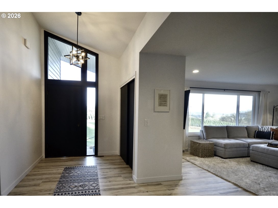 10854 Summit Loop Road Southeast Turner, OR 97392 - Photo 5 of 35 a living room with furniture and a large window