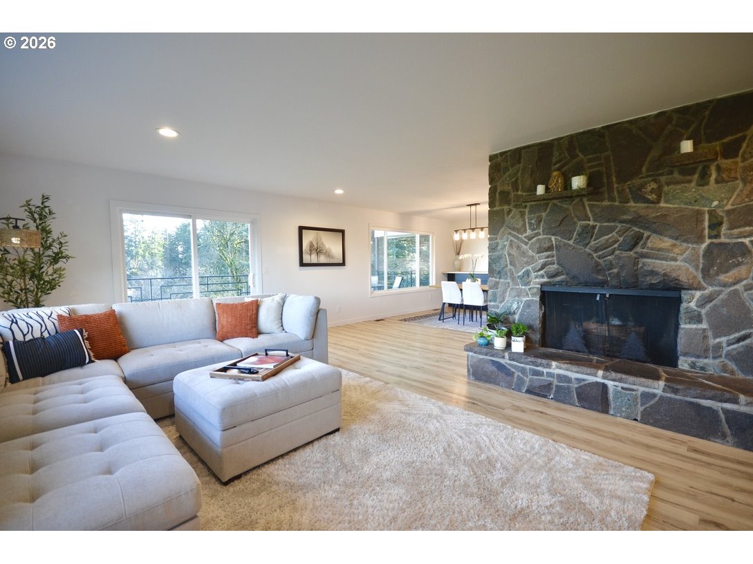 10854 Summit Loop Road Southeast Turner, OR 97392 - Photo 7 of 35 a living room with furniture and a fireplace