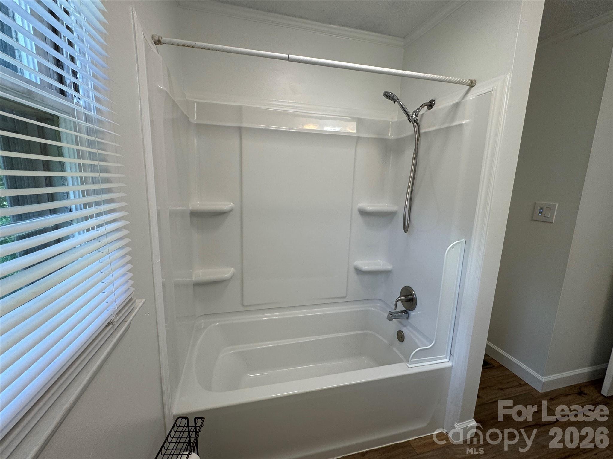 315 Pine Road Mount Holly, NC 28120 - Photo 10 of 21 a bathroom with a bathtub and a shower