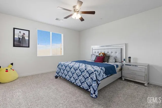 a bed room with a bed and a window