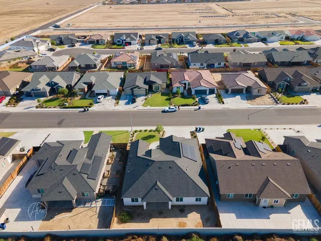 a view of multiple houses with outdoor space