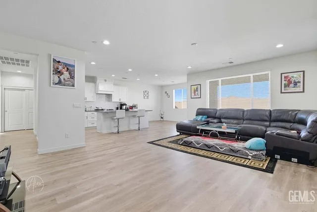 a living room with furniture and a table