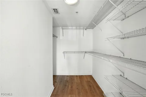 a view of a room with wooden floor