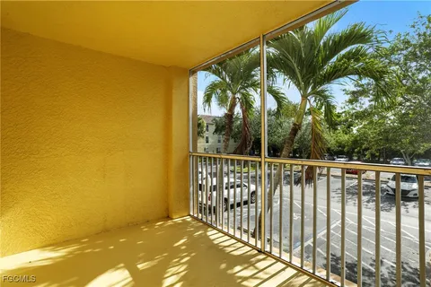 a view of balcony with wooden floor