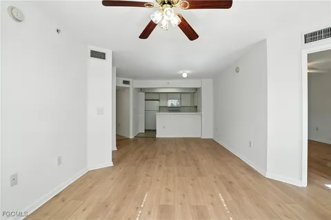 a view of a kitchen with a sink and cabinets