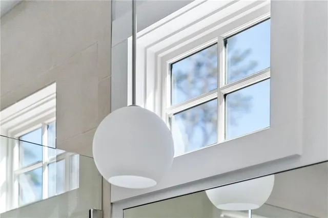 a bathroom with a sink a mirror and a bathtub