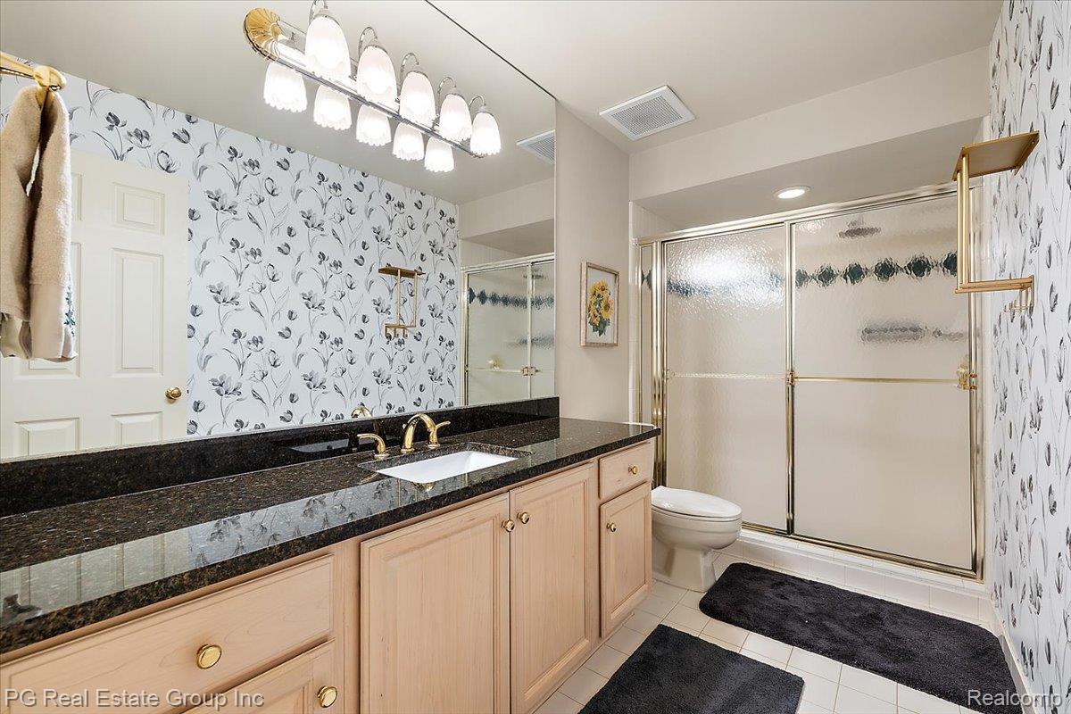 3571 Cedar Brook Drive Rochester, MI 48309 - Photo 54 of 57 Full bathroom with wallpapered walls, vanity, a shower stall, and light tile patterned floors