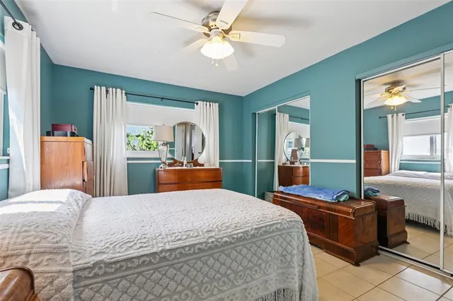 a bed room with a bed and a chandelier