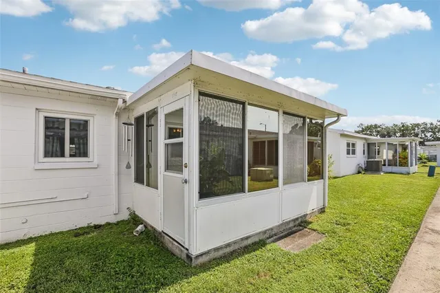 a view of an house with backyard porch and entertaining space
