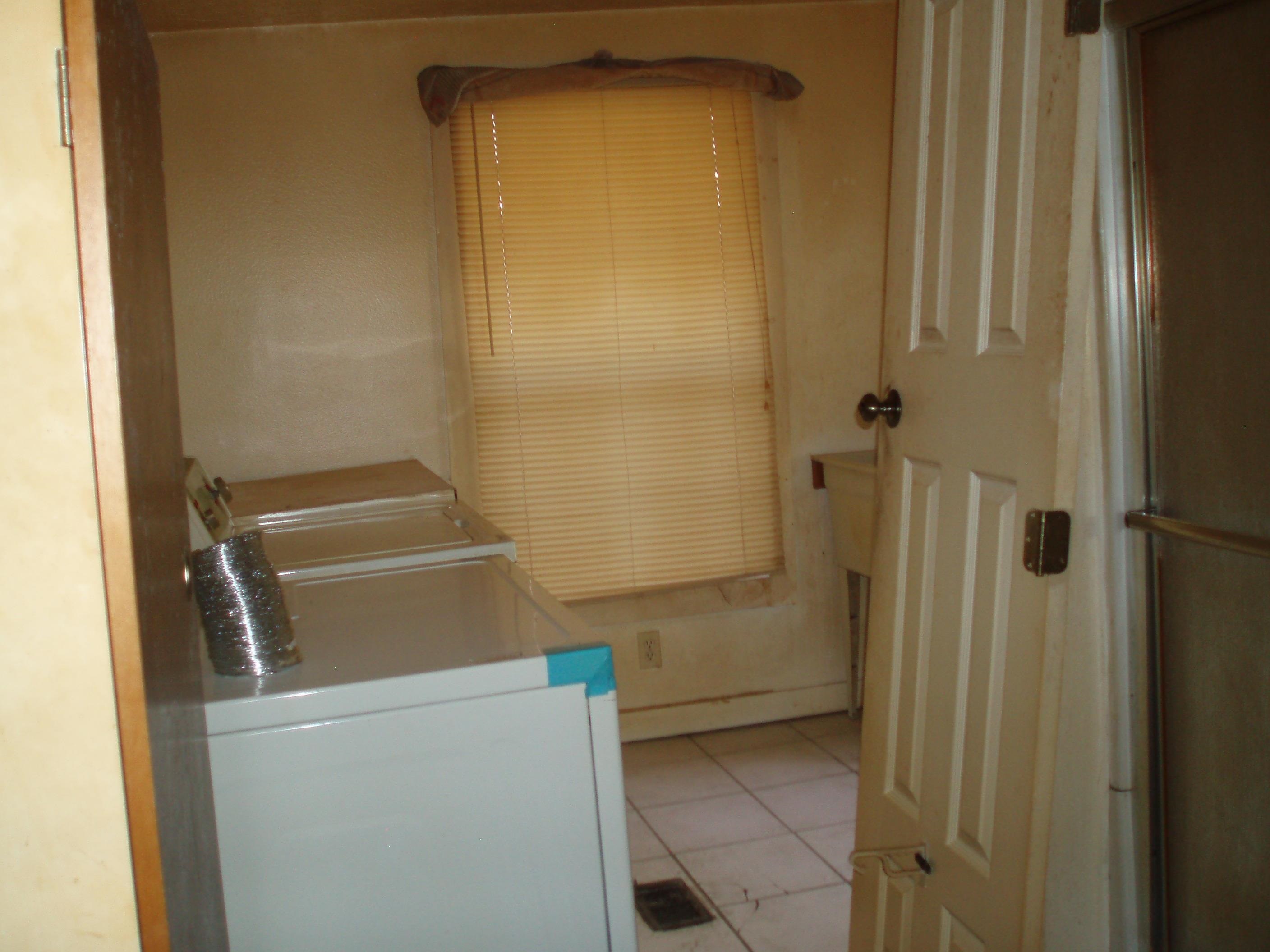 100 Julia Street St. Augustine, FL 32084 - Photo 11 of 11 Laundry room with light tile patterned floors and washer and dryer