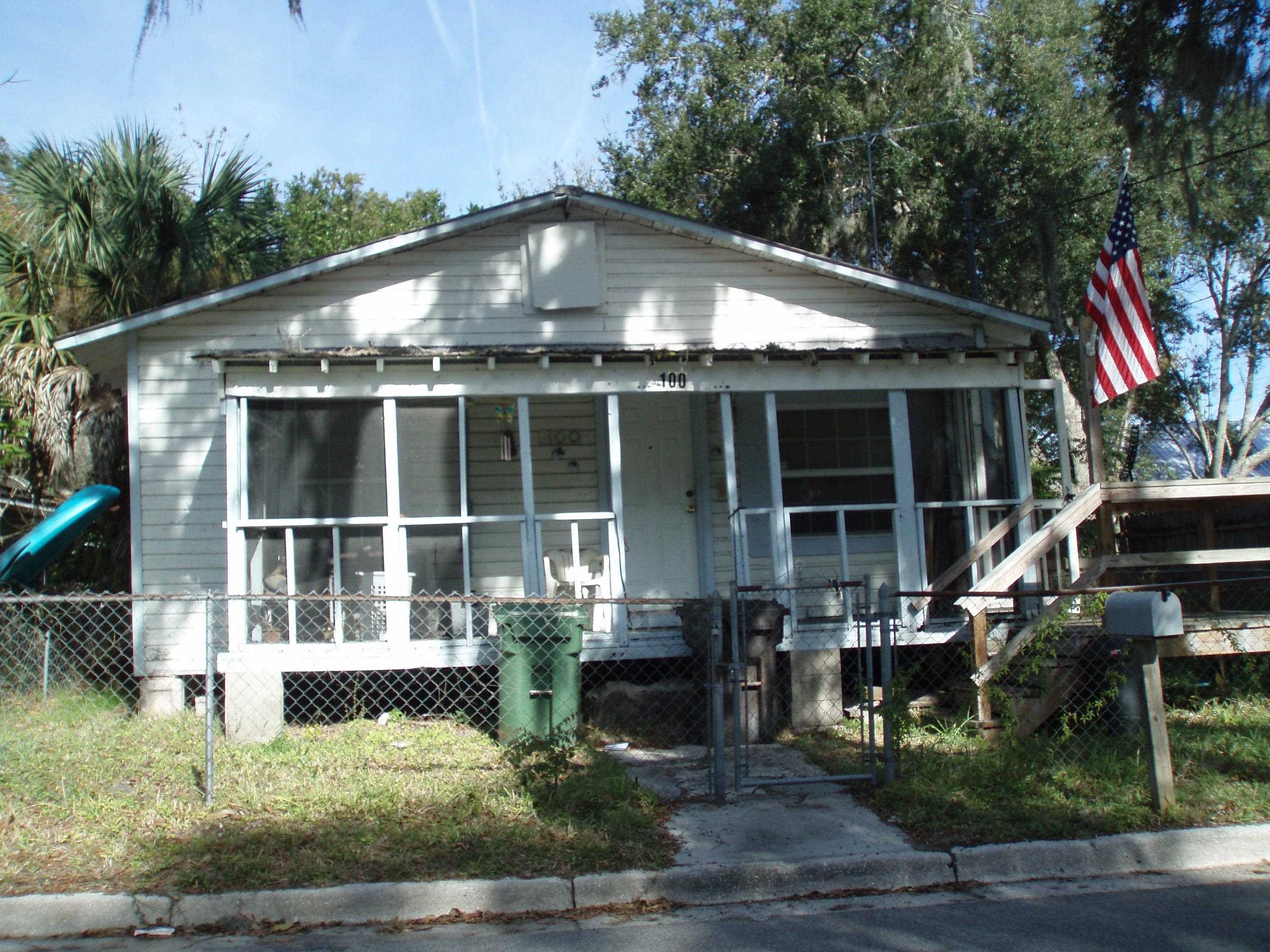 100 Julia Street St. Augustine, FL 32084 - Photo 4 of 5 a front view of house and yard with green space