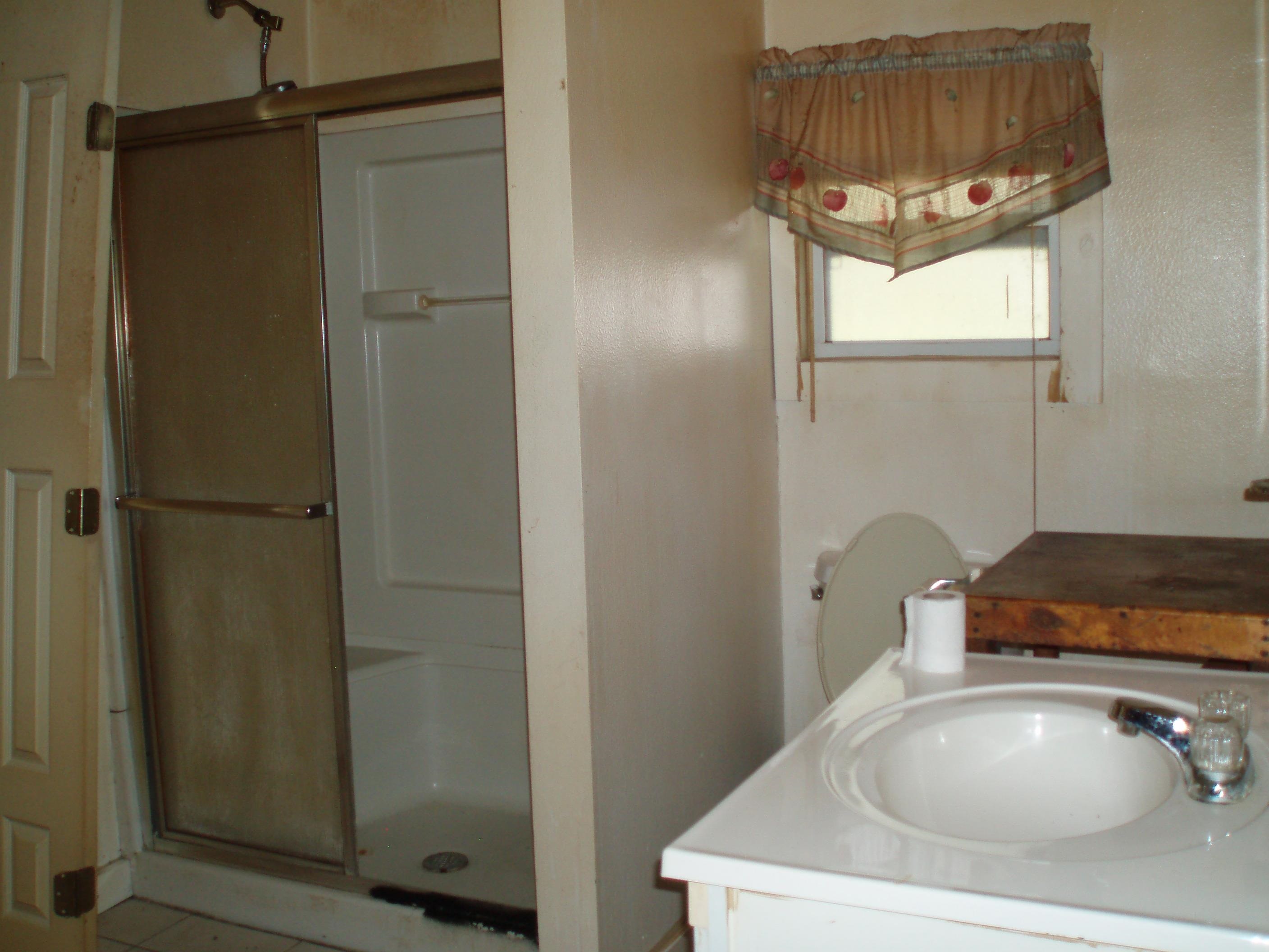 100 Julia Street St. Augustine, FL 32084 - Photo 5 of 11 Bathroom featuring vanity and a shower stall