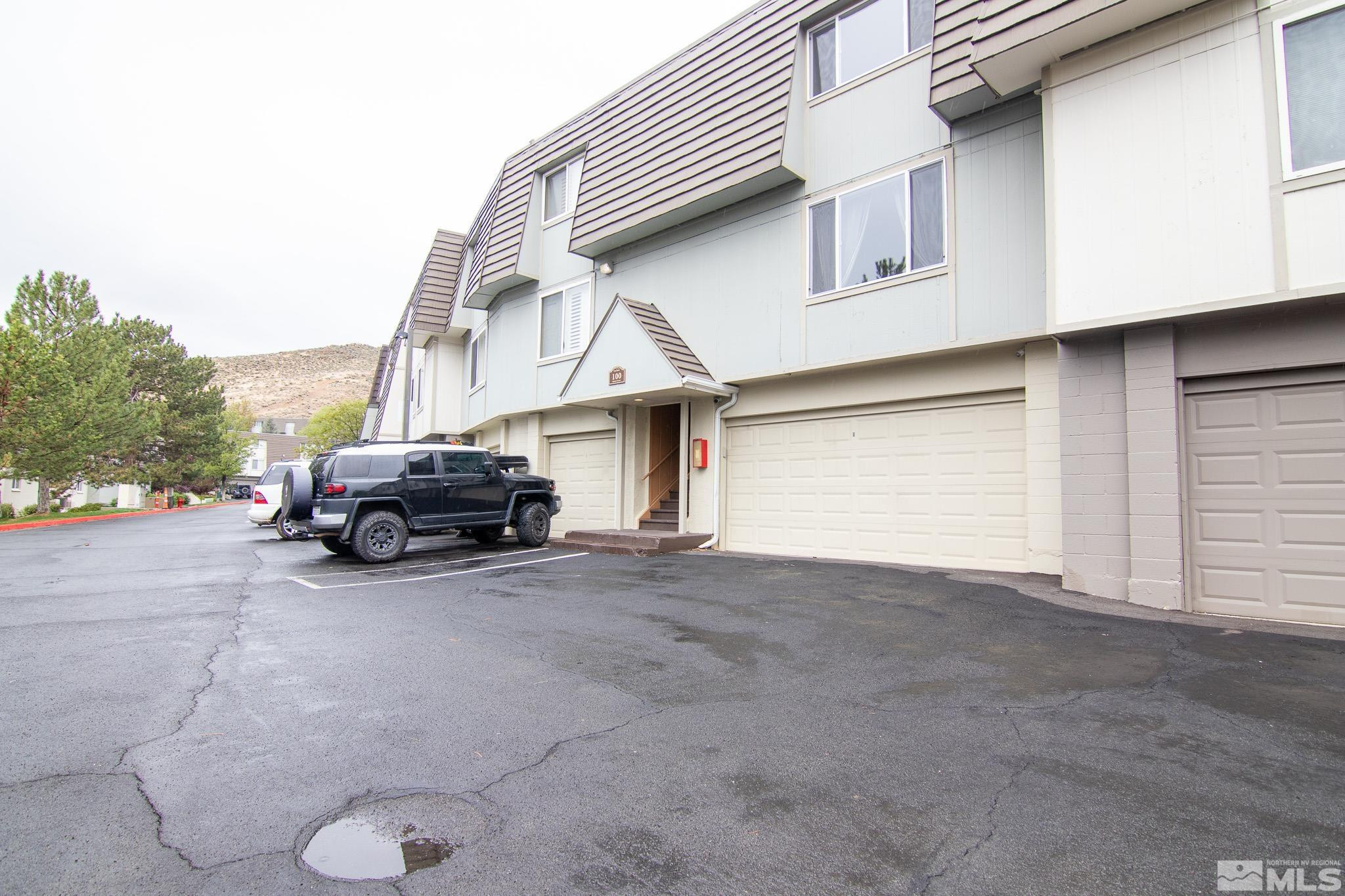 100 Bisset Court, Unit B Reno, NV 89503 - Photo 28 of 31 a view of car parked in front of house