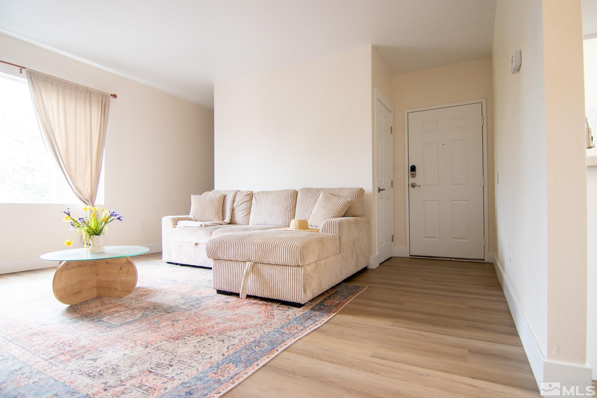 100 Bisset Court, Unit B Reno, NV 89503 - Photo 5 of 31 a living room with furniture and a rug