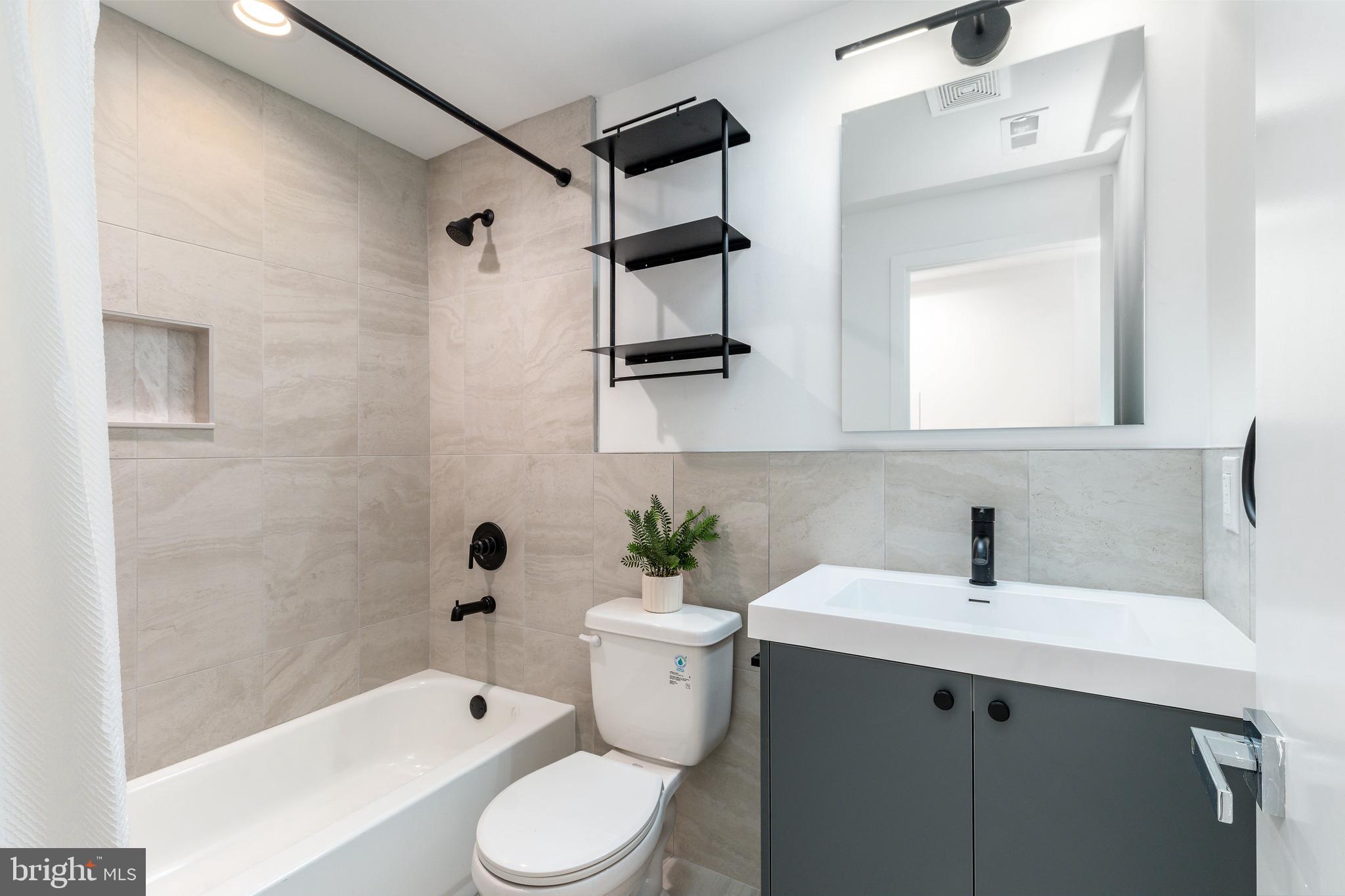 2925 Master Street Philadelphia, PA 19121 - Photo 28 of 41 a bathroom with a sink toilet and shower